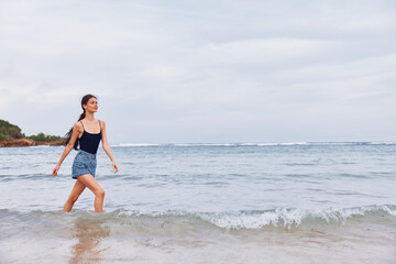 Fototapeta premium beach woman travel person summer sunset lifestyle smile running young sea