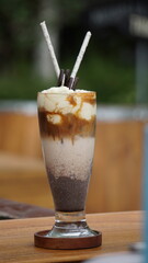 Coffee with liquid served on the table