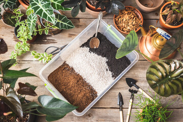 Top view of container with soil mix ingredients - Powered by Adobe
