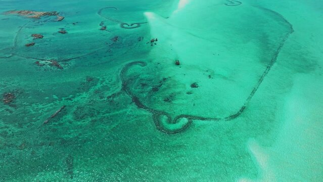 Aerial view of stone tidal weirs in Penghu, Taiwan.