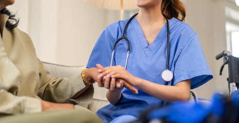 Portrait of asian woman physiotherapist carer helping physical and discussing consulting talk with senior woman patient by doing exercises, caring, caregiver sitting at home.healthcare and medicine