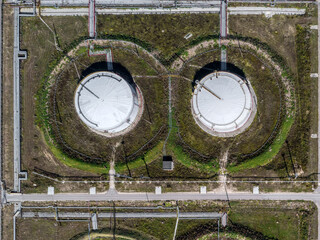 Oil storage containers with pipeline to refinery aerial view
