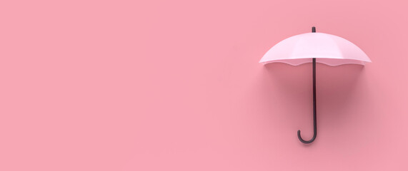 Pink umbrella isolated on a pink background.
