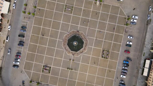 Fountain in center Amazing aerial top view flight 
Budweis Budejovice old town in Czech Republic, summer of 2023. vertical bird's eye view speed ramp Hyperlapse motionlapse timelapse 4K uhd footage.