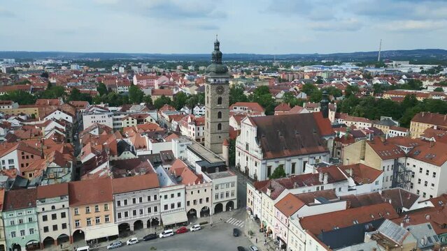 medieval Tower at the historic market square. Spectacular aerial top view flight 
Budweis Budejovice old town in Czech Republic, summer of 2023. panorama orbit drone
4K uhd footage.