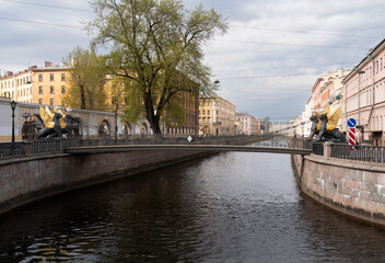 Embankment of the Griboyedov Canal and Bank Bridge on a sunny spring morning, St. Petersburg, Russia