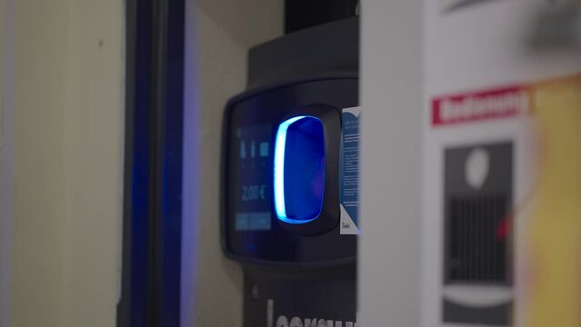 Returning empty recycling bottles in supermarket. Recycling automated machine. Eco friendly lifestyle and cashback. Ecology concept. Eco friendly. Vending machine selling deposit bottles. 