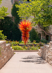 Fiber glass artistry of sculptor on display at Denver Botanic Gardens .