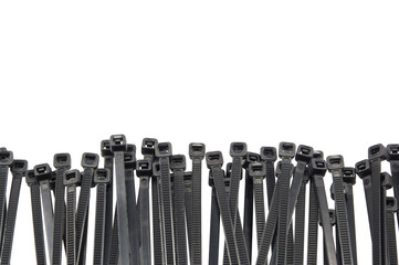 Heap of black cable ties isolated on white background, Grey plastic, Nylon cable ties