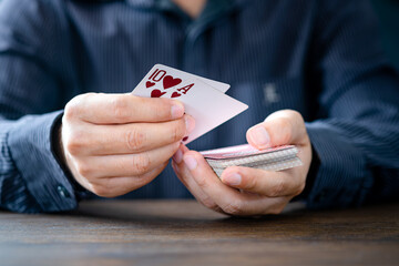 Shuffle the cards gambling  poker cards in casino and casino chips poker table game business gambling concept