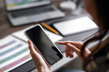 Close up of asian woman hand using a smart phone for mock up display montage.