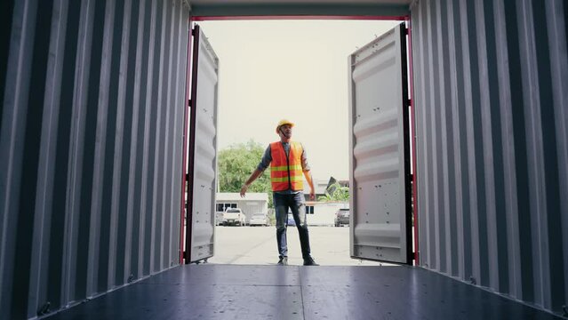 Foreman open container box walk in side and check neatness prepare to transport in terminal logistic warehouse. Cargo shipping Transport concept
