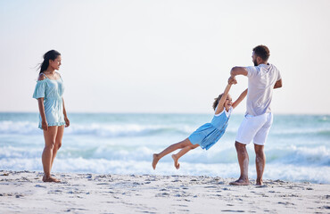 Mother, beach or father playing with child in air on family holiday, vacation or weekend break...