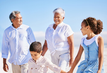 Beach, grandparents or happy kids holding hands, walking or smiling in summer as a family in nature. Grandmother, senior grandfather or young children siblings bonding or taking walk together at sea