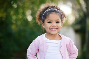 Happy, smile and portrait of a kid in a garden with joy, positive emotion and childhood growth....