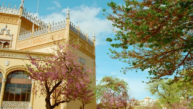 The Parque Maria Luisa, Seville, Andalusia, Spain, expansive lush park with gardens, fountains, monuments, and the impressive Plaza de Espana