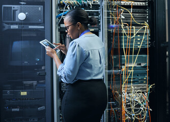 Server room, woman and engineer with tablet for cybersecurity, programming or cable maintenance. Black female technician in datacenter for network, software or system upgrade with IT app and internet