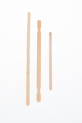 Natural wooden stirrers toothpicks three wood piece isolated on white background