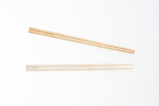 wooden chinese chopsticks isolated on white background