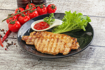 Grilled pork steak with ketchup