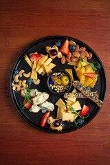 cheese plate on the wooden background