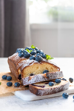 fresh blueberry loaf of bread muffin cake with mint closeup on a table