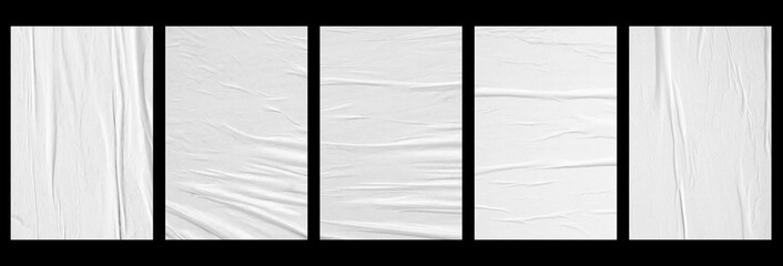 white crumpled and creased glued paper poster set isolated on black background