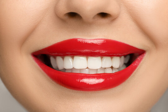 Smiling woman with healthy teeth, closeup view