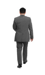 Obraz na płótnie Canvas Businessman in suit walking on white background, back view