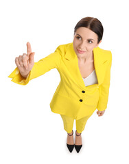 Beautiful businesswoman in yellow suit pointing at something on white background, above view