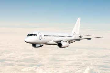 Fototapeta na wymiar White passenger airplane fly in the sky