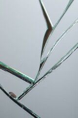 Fototapeta na wymiar Broken mirror with many cracks as background, closeup view