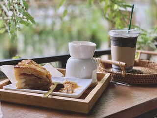 Coffee cup and coffee beans on table