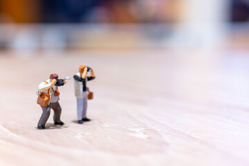 Miniature people Photography holding a camera and copy space for text