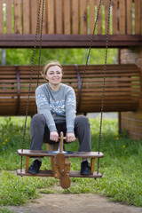 Fototapeta premium Woman on swing at playground.