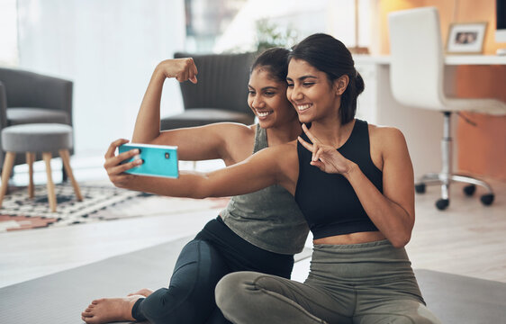 Exercise, peace sign and selfie of women together at home for social media memory or post. Indian sisters or female friends with a photo for influencer update, fitness motivation or muscle results