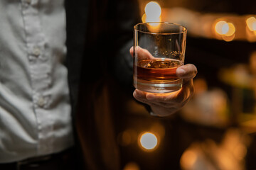  Barman pouring whiskey whiskey glass celebrate whiskey on a friendly party in  restaurant