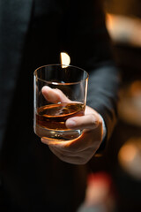  Barman pouring whiskey whiskey glass celebrate whiskey on a friendly party in  restaurant