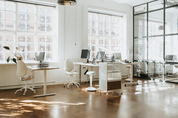 Empty modern workspace with computers arranged on table