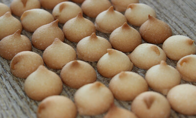 Miniature Round Biscuits Laid Out In Many Even Rows On A Wooden Board Stock Photo For Bakery Backgrounds 
