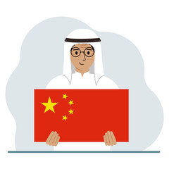 A man holds a Chinese flag. The concept of demonstration, national holiday or patriotism. Nationality.