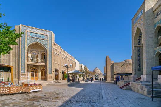 Ancient street with historic brick architecture in the old town of Bukhara, Uzbekistan. Silk Road heritage