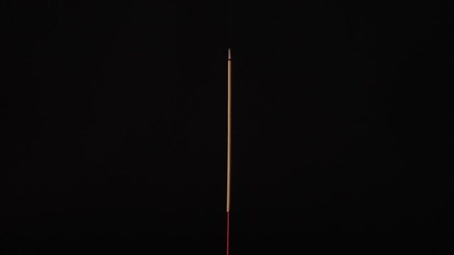 Fast speed closeup scene on a joss stick combustion form start burning reducing range since long to short and finished in the end, time lapse of incense from ignite untill extinguish.