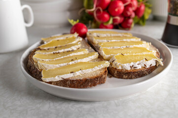 Traditional german cheese sandwich with sourdough bread, butter and harzer cheese with caraway seeds