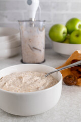 Yogurt with dried figs in a bowl. Delicious meal for fitness, diet, healthy eating with natural sweetness.