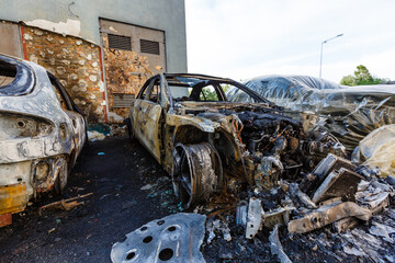 After bombing. Russian army burned cars, dwelling houses and killed people in Irpin town, Kyiv Oblast on March 2022. Terror and genocide of Ukrainian people
