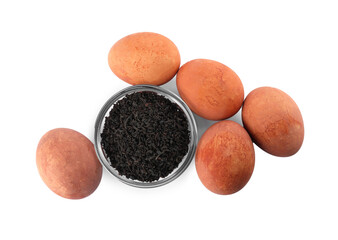 Naturally painted Easter eggs on white background, top view. Tea used for coloring