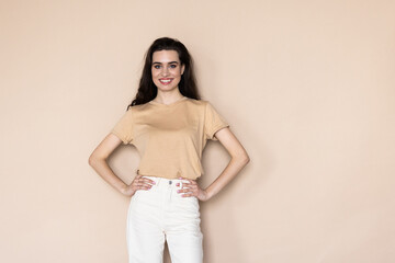 Obraz premium Healthy woman holding hand against beige background