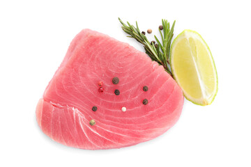 Raw tuna fillet with spices and lime wedge on white background, top view