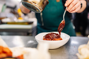 chef cooking dessert in the kitchen